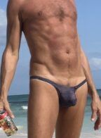 At the beach in a thong